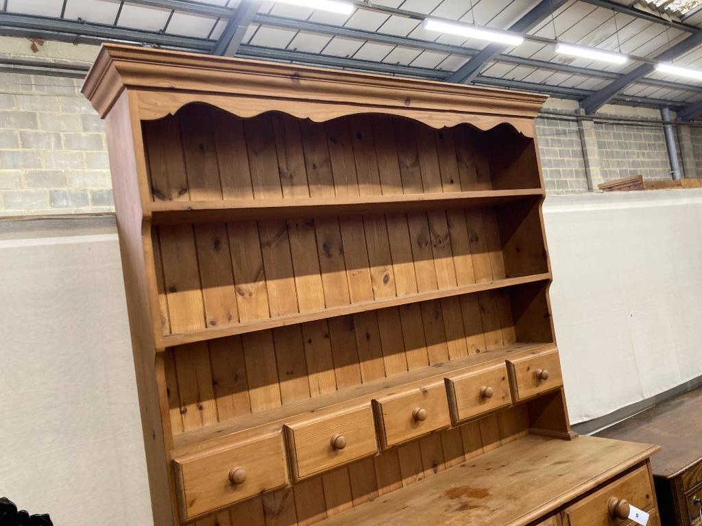 A Victorian style pine dresser, length 140cm, depth 44cm, height 208cm